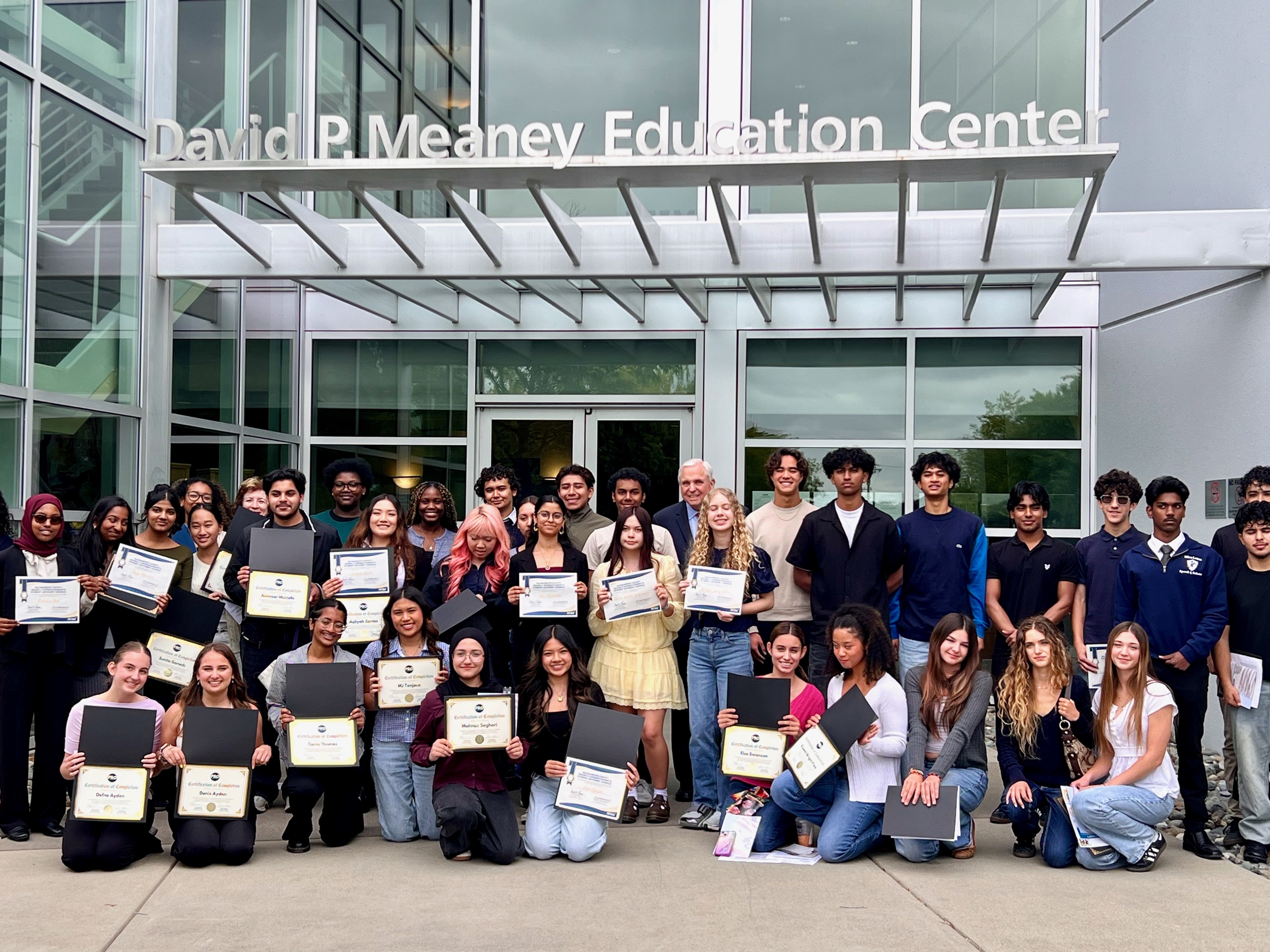 Members of the SCOE Student Advisory Council holding certificates outside the county office